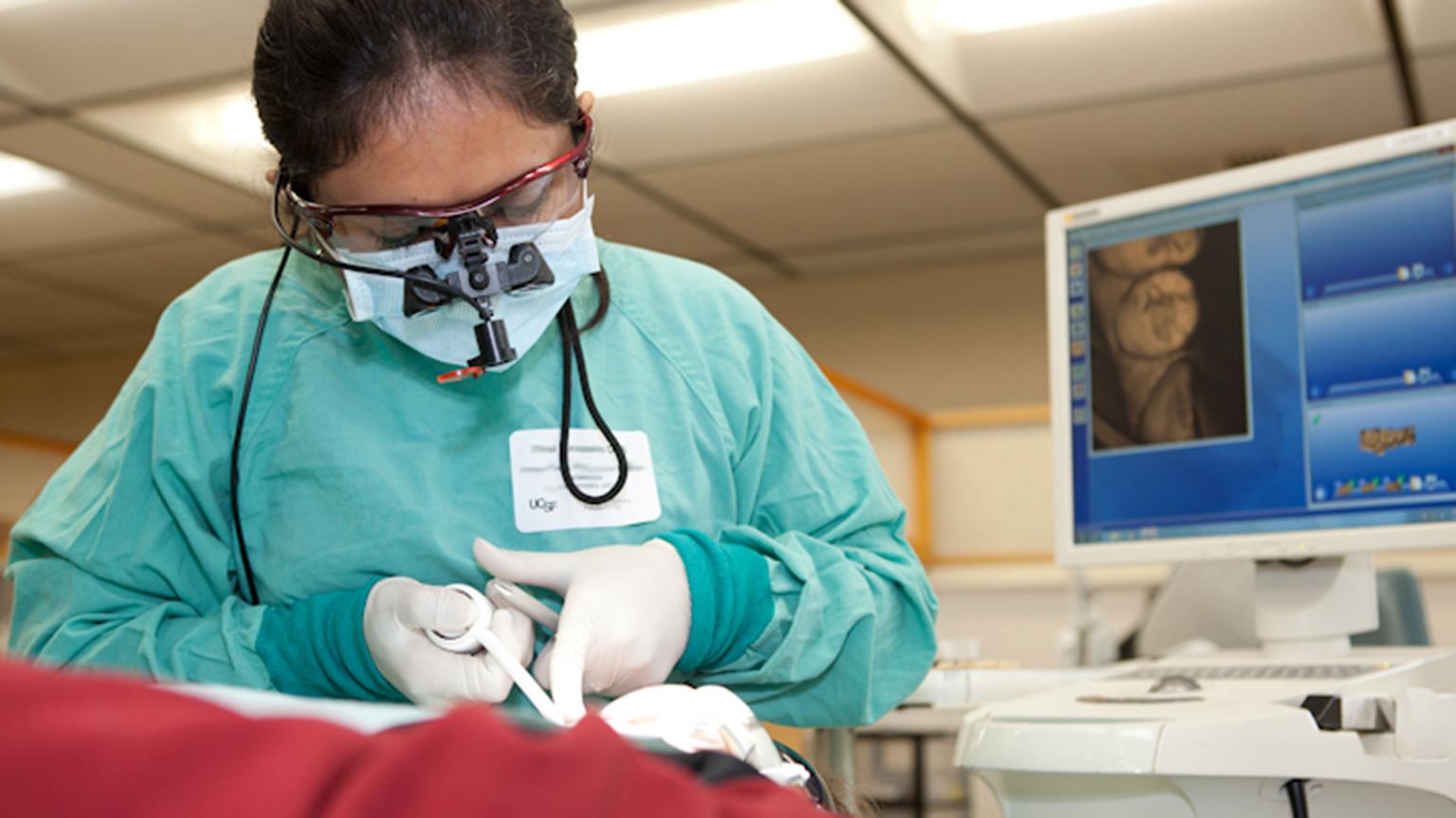 dentist treats prosthodontic patient