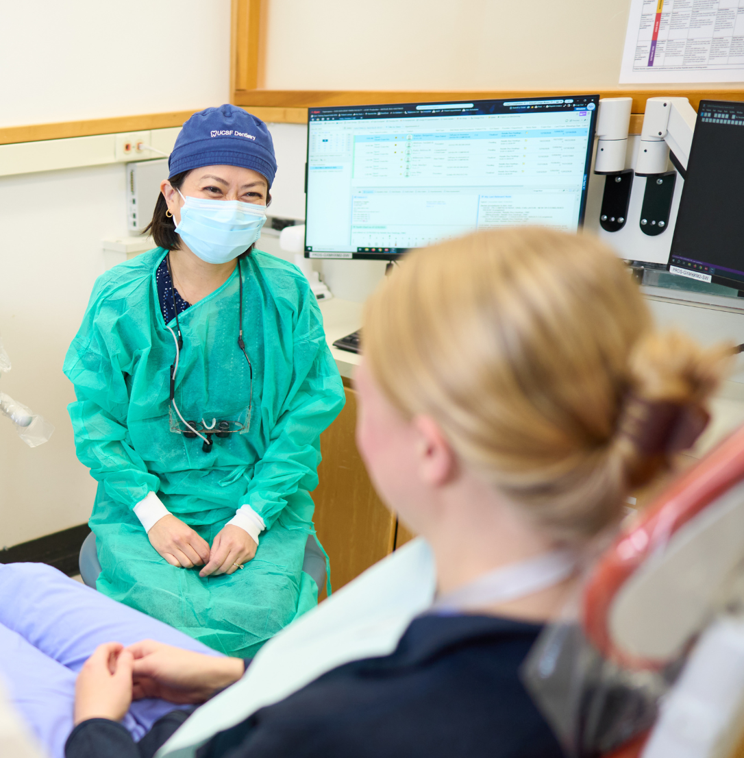 Faculty provider speaks with a patient.