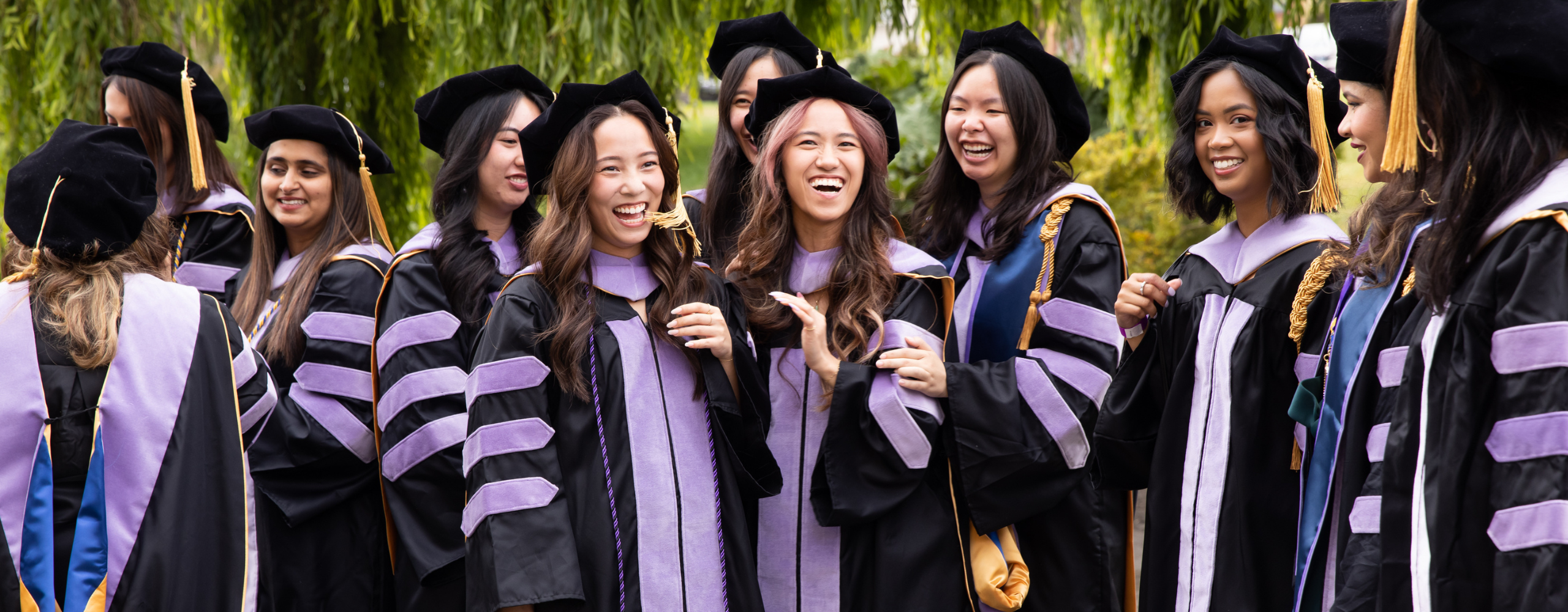 UCSF School of Dentistry graduates gather in their caps and gowns before the ceremony