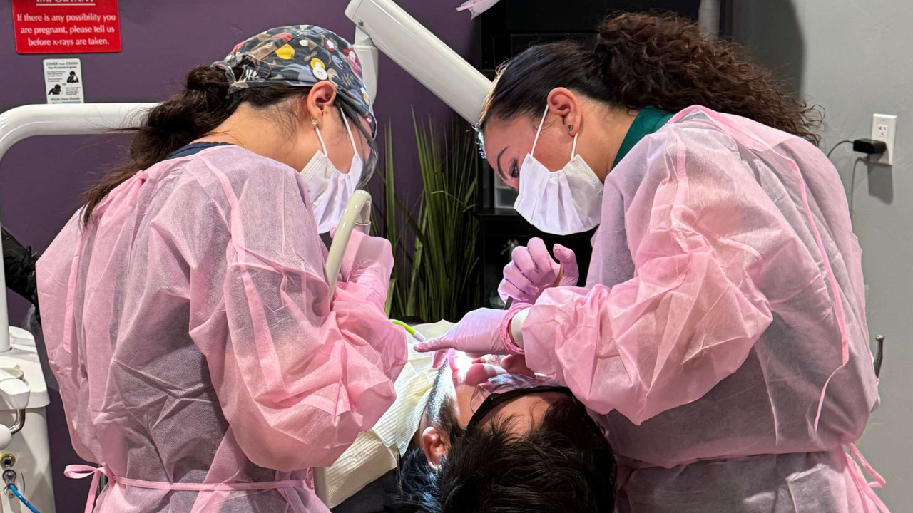 DDS students provide care to a patient at an externship clinic