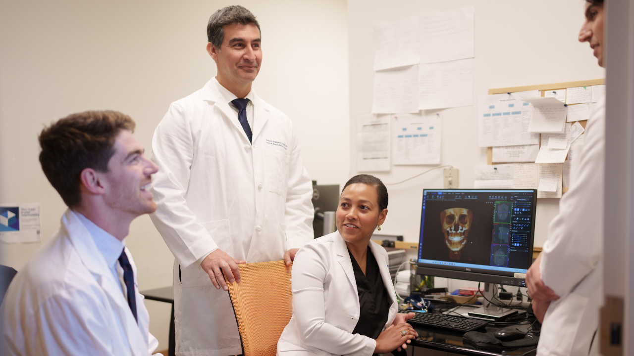 Sohail Saghezchi, DDS, MD and three residents