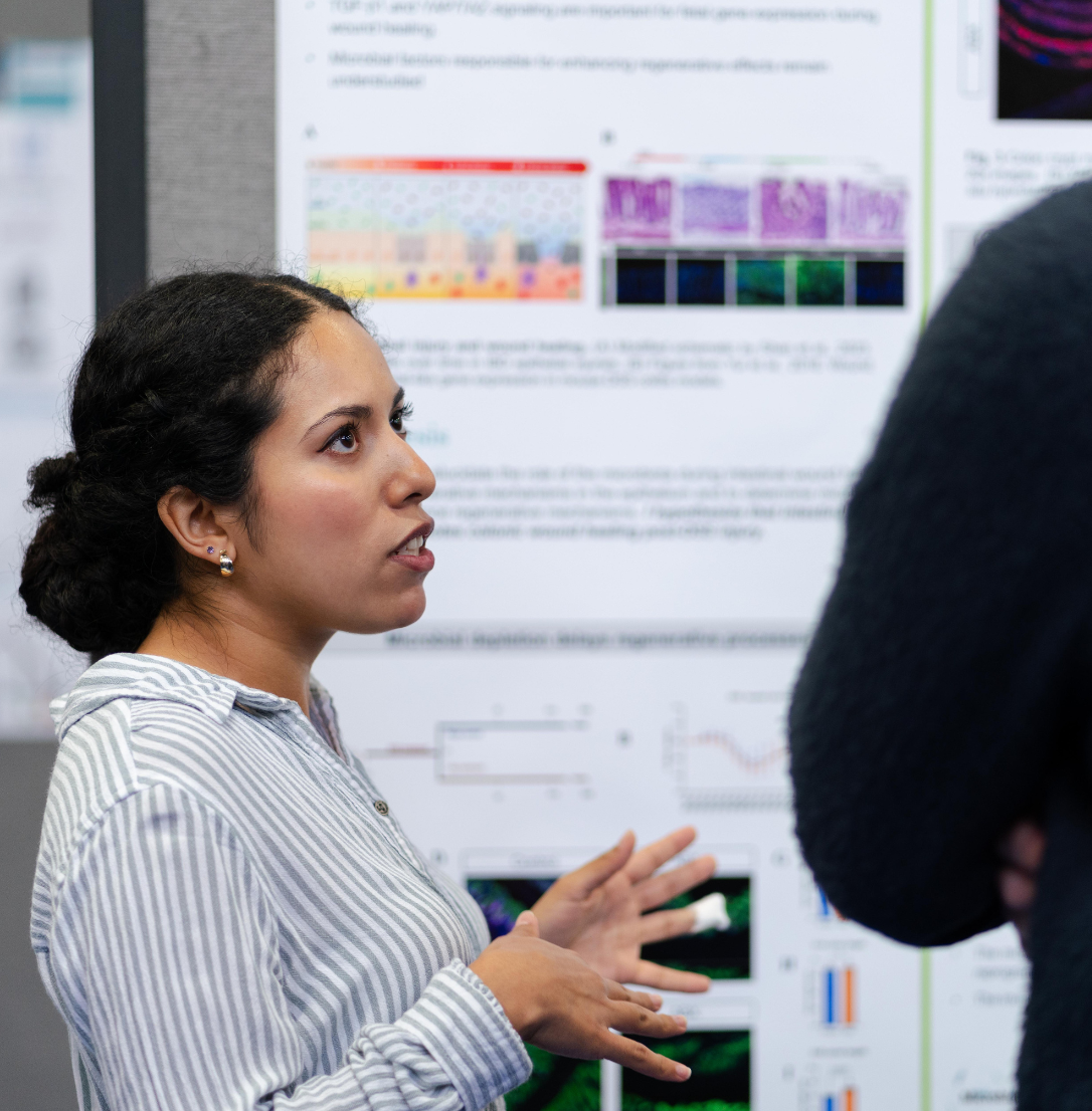 Student researcher presenting at Research and Clinical Excellence Day