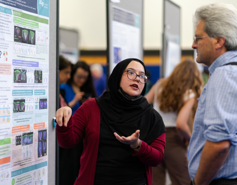 PhD student presents research to a faculty member at the annual RCED event