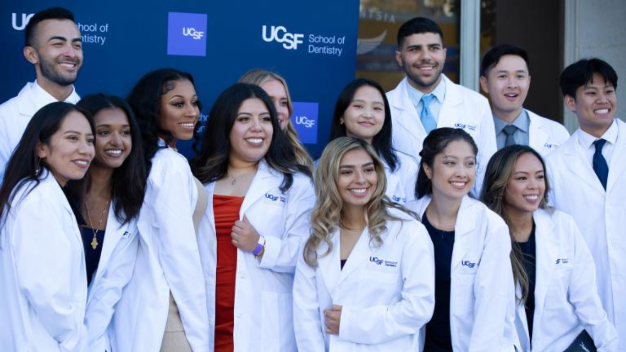 Students pose in their white coats at the annual White Coat Ceremony