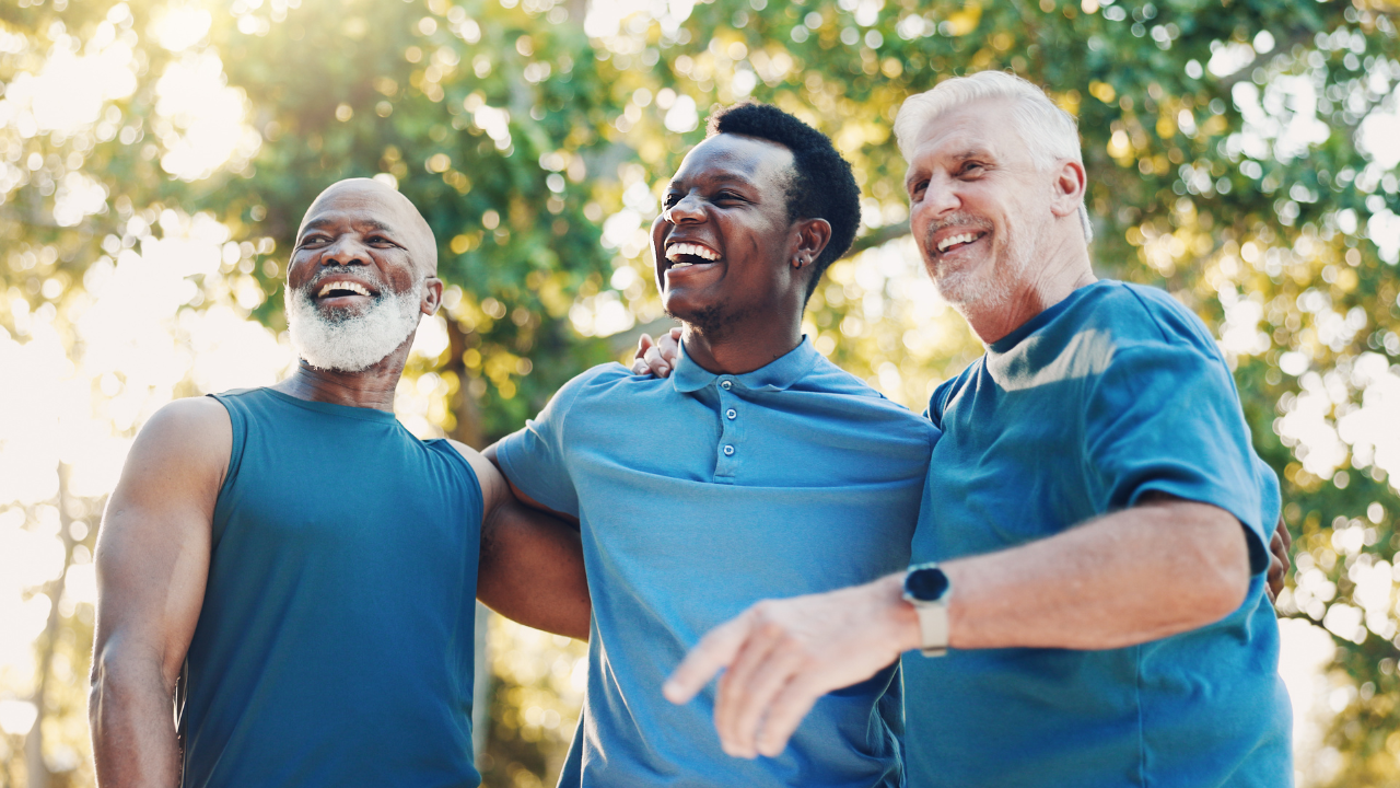 three men - two older and one younger - in workout clothes