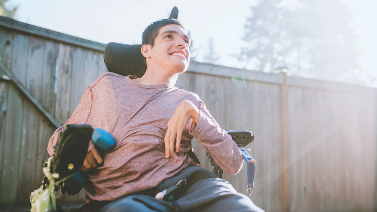 man with physical disabilities sitting in a wheel chair