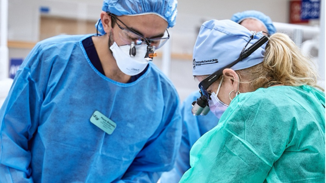 dental clinicians provide care to a patient