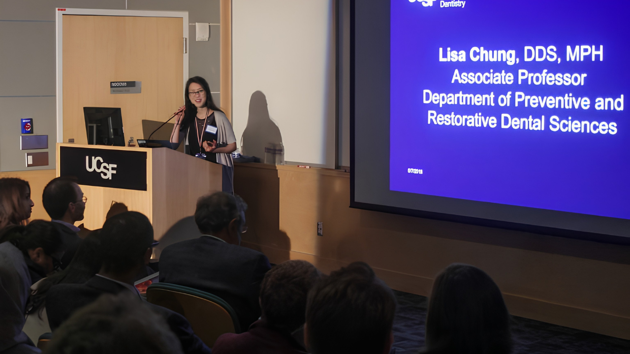 Dr. Lisa Chung addresses the Global Oral Health Symposium audience.