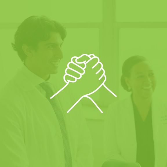 hands clasped icon over a photo of two UCSF residents
