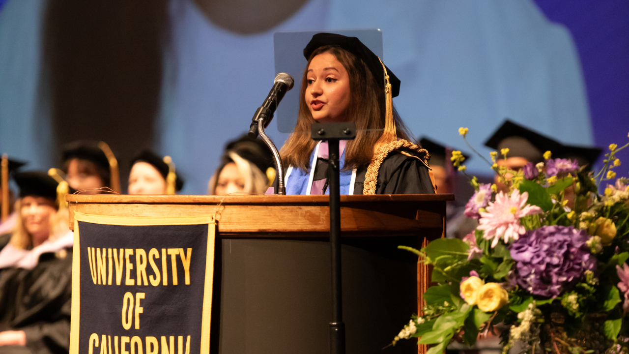 Samhita Joshi, DDS, at the podium delivering the student address