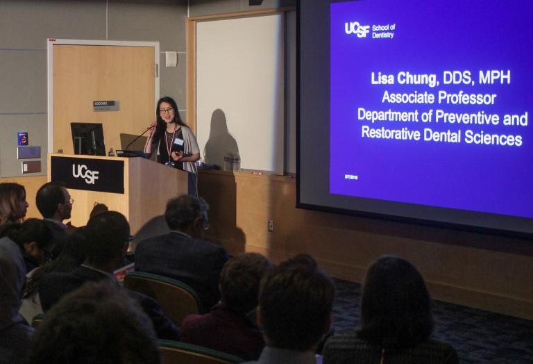 Dr. Lisa Chung addresses the Global Oral Health Symposium audience.