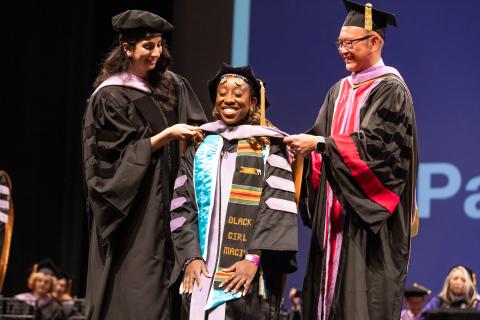 Happy dentistry graduate hooding