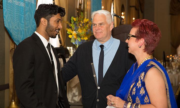 Mugunth Nandagopal (left), IDP class president, chats with Roger Mraz, program administrator for the Office of Graduate and Research Affairs, and Sara Hughes, MBE, associate dean for education and student affairs. Photos by Elisabeth Fall