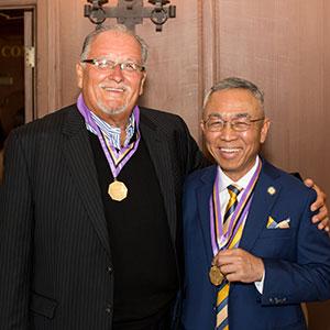2017 Medal of Honor recipient Dr. Antonio Ragadio '69 (right) and 2016 recipient Dr. Michael Lopez '74 show off their medals.