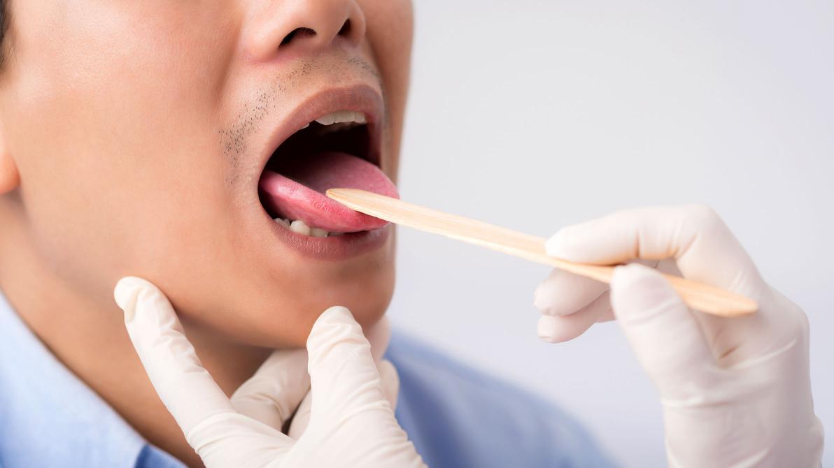 male patient gets oral exam