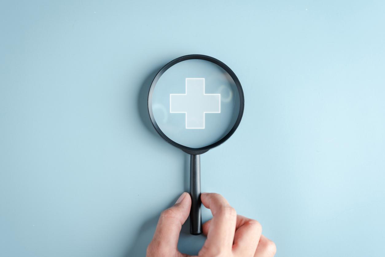 Health insurance concept. Hand people holding Magnifier focus to plus symbol and healthcare medical icon, health and access to welfare health concept. stock photo