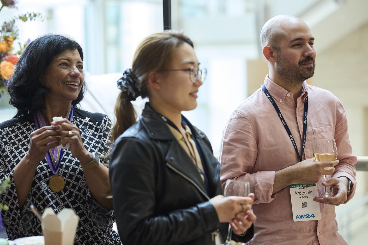 image shows ucsf dentistry alumni watching presentation