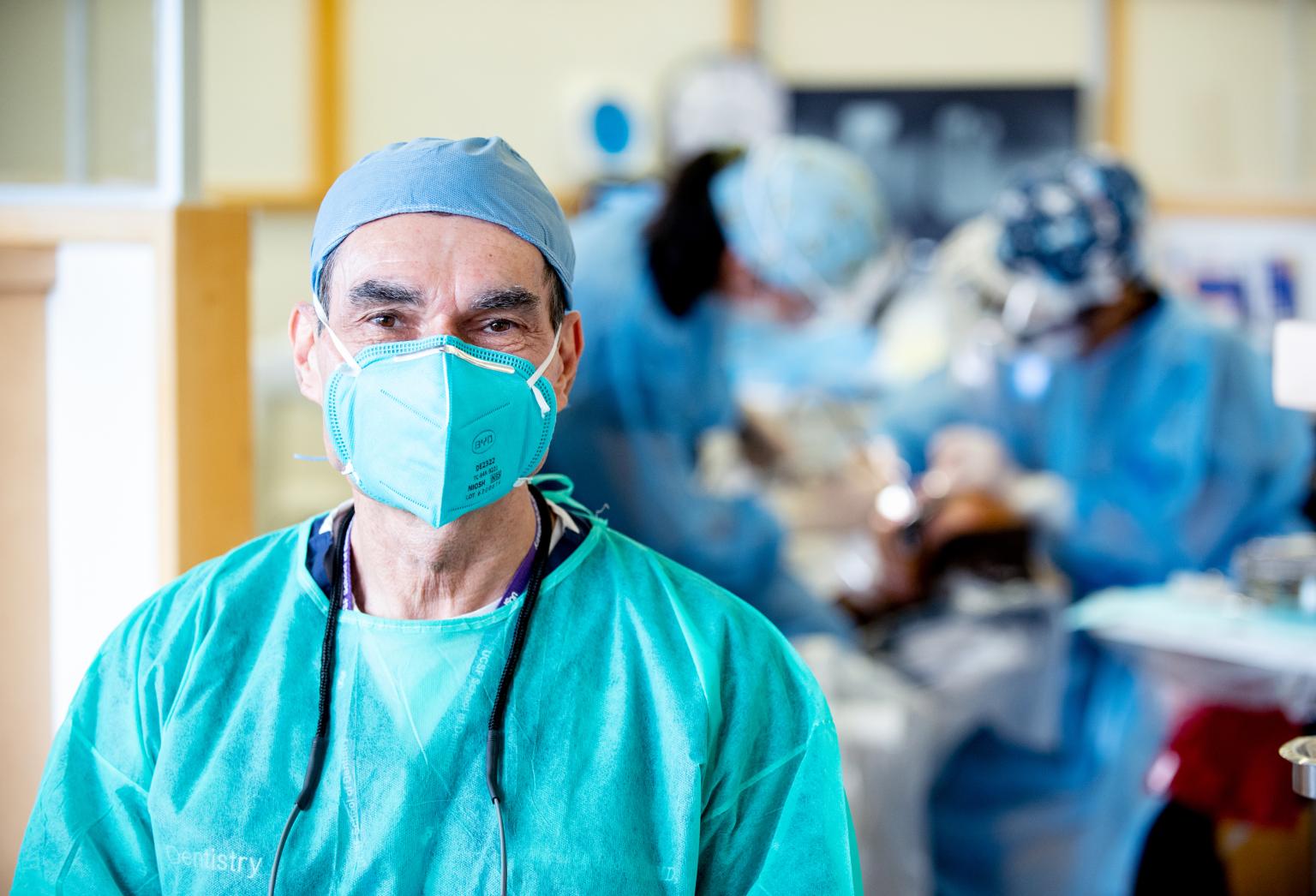 Dean Reddy in clinic wearing PPE
